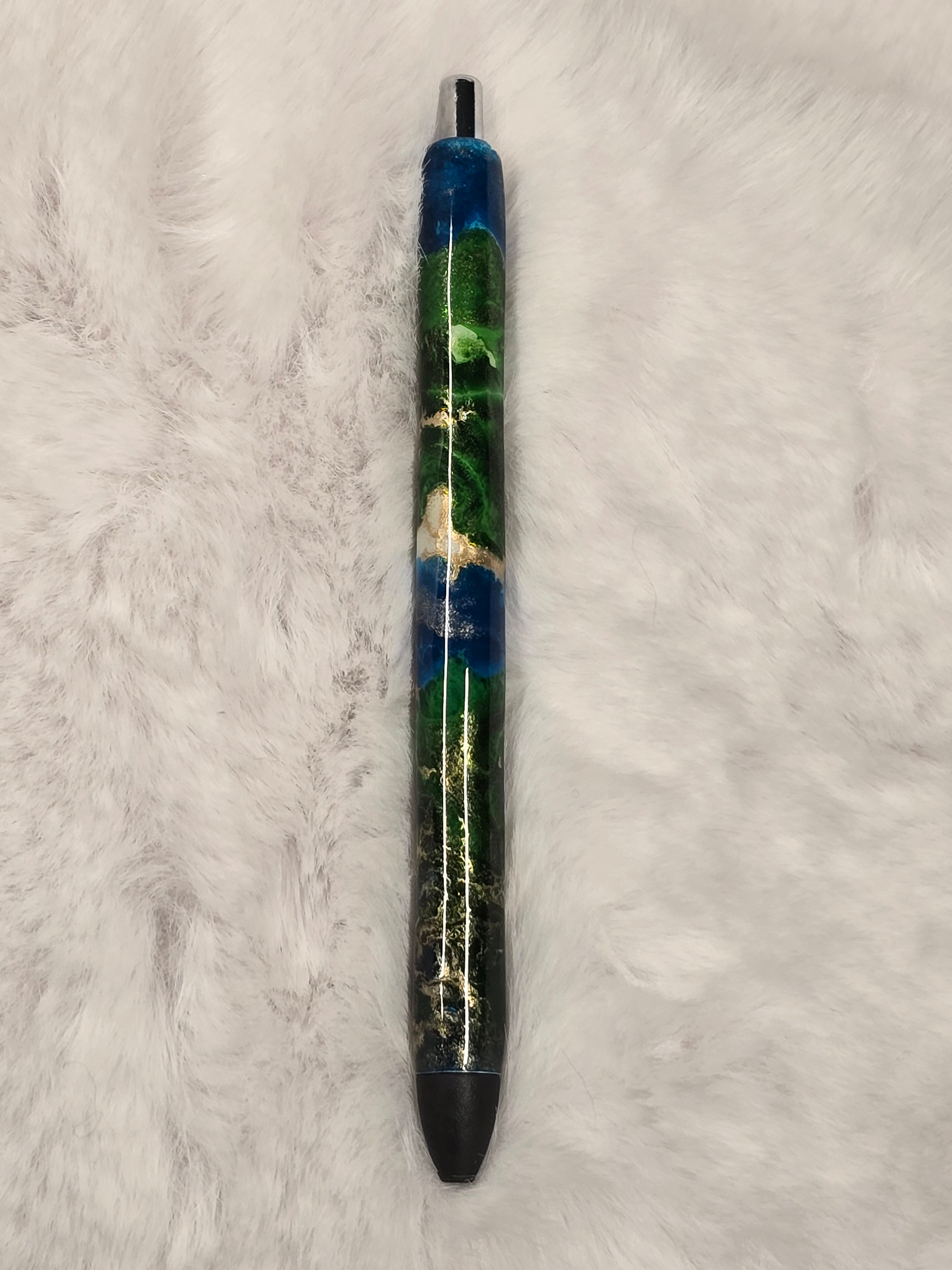 Pen with decorative elements on a texture surface